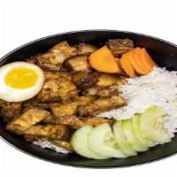 Taiwanese Stewed Pork With Rice · Stewed pork, ground pork suae, soy sauce egg, cucumbers, and carrot son white rice with chic...