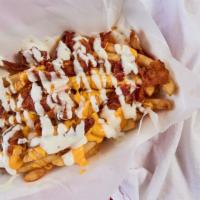 Xpress Fries · Pound of fries topped with bacon, wiz, and ranch.