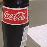 Coke 20 Oz · Any flavor Coca Cola