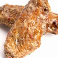 Garlic Parmesan Wings · Delicious, crispy wings tossed in a Garlic Parmesan sauce and fried to perfection. Served wi...