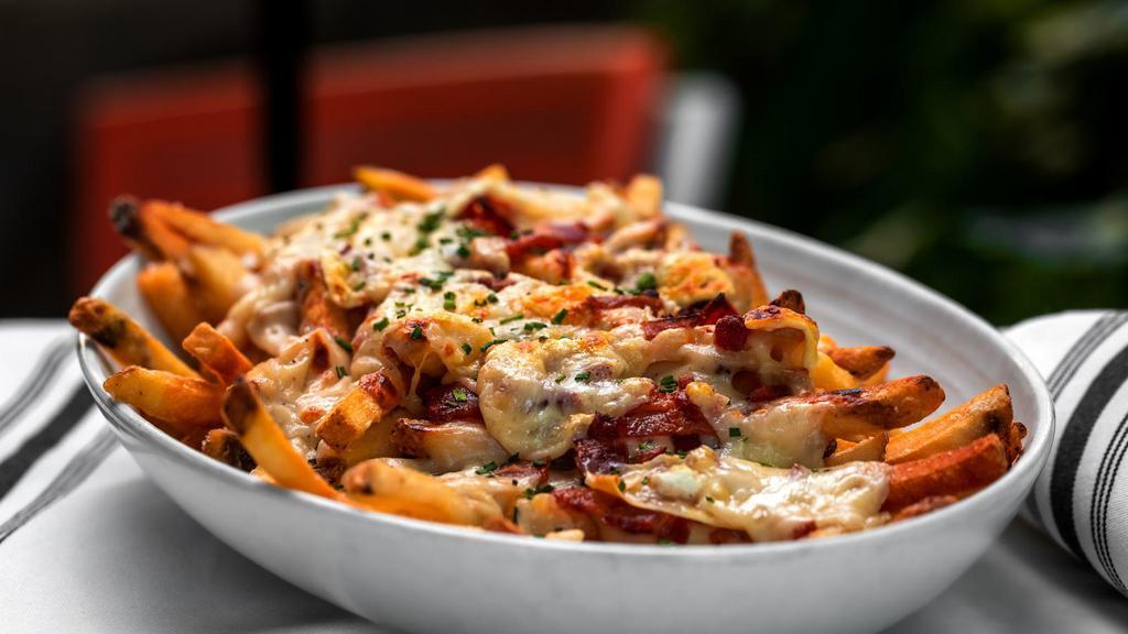Cajun Salmon Loaded Fries · Golden crispy fries salted and fried to perfection and topped with Cajun salmon and melted cheese.