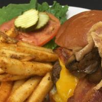 Smoked Bbq Western · Angus ground beef burger topped with a tangy BBQ sauce, smoked bacon and gouda cheese with o...