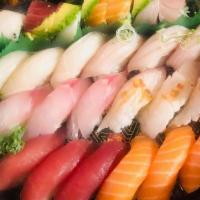 May Flower · 18 pc sushi ,1 earthquake roll,1 Rainbow roll