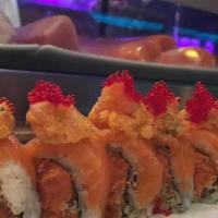 Double Spicy Roll · Spicy tuna crunchy inside, salmon on top then &spicy yellowtail over the whole roll
