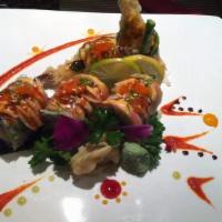 Thai Spicy  Roll · Shrimp tempura and mango inside, avocado on top crabmeat over the roll