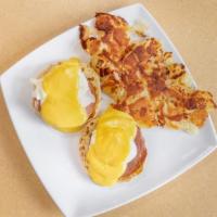 Classic Benedict · Poached eggs on a toasted English muffin and Canadian bacon. Topped with hollandaise sauce a...