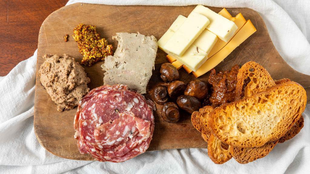 Charcuterie Board · Assorted house made cured meats, pickles, cheese, whole grain mustard, fruit jam and crostini