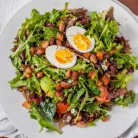 Cobb Salad · lettuce, cherry tomatoes, avocado, HOS bacon, hard cooked eggs, grilled red onion, blue chee...