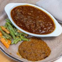 Kaye Wot · spicy beef stew simmered in spiced butter, chili-pepper sauce, ginger root, & Ethiopian-card...