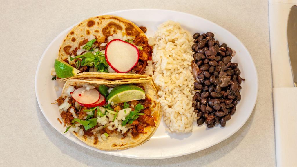 Taco Platter · Your Choice of two tacos rice and Beans, Taco served with onions cilantro, lime, radish, your choice of corn, flour, or hard shell tortilla. Choice of protein at an additional cost.
