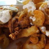 Fried Calamari · With hot cherry peppers, drizzled lemon aioli and served  with marinara sauce