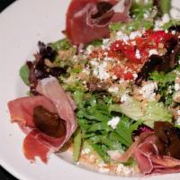 Grilled Fig Salad · Fresh baby greens tossed in homemade sherry vinaigrette dressing, garnished with prosciutto ...