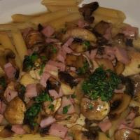 Marsala, Chicken · Pan seared,  sautéed with fresh mushrooms and ham in a marsala wine sauce. Served with penne