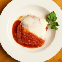 Homemade Lasagna · Layers of meat and Ricotta cheese topped with marinara sauce and Mozzarella baked in the oven.