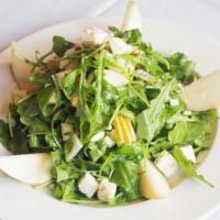 Insalata Gorgonzola · Pears, candied walnuts, and gorgonzola cheese tossed with arugula in a honey white balsamic ...