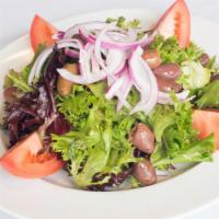Insalata Bistro · Spring mix with plum tomatoes, red onions, and mixed olives in a balsamic and oil dressing.