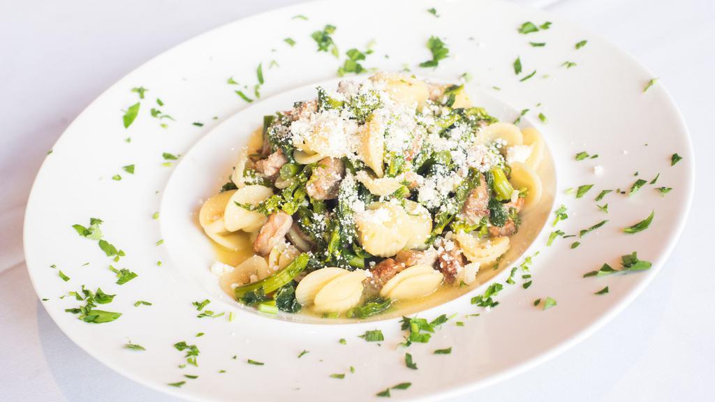 Orecchietti Con Broccoli Rabe · Little ear pasta tossed with broccoli rabe, spicy sausage, and fresh Pecorino Romano cheese in garlic and olive oil.