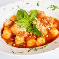 Gnocchi Pomodoro · Homemade bistro gnocchi served with homemade tomato sauce with fresh basil and Pecorino Roma...