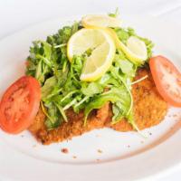Vitello Milanese · Pan fried veal cutlet topped with melted fresh mozzarella, baby arugula and over-roasted hei...