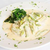 Vitello Gino · Veal medallions served with crab meat and asparagus tjps in a lemon cream sauce.