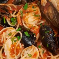 Spaghetti Pescatore · Shrimp, clams, mussels, white wine cherry tomato sauce.