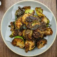 Crispy Brussel Sprouts · Flash fried brussels sprouts • spicy soy caramel