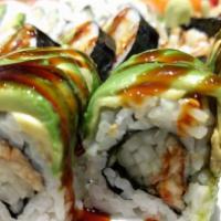Green Dragon Roll · Eel and cucumber inside, sliced avocado and tobiko on top with eel sauce.