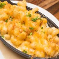 Mac & Cheese · Made with a Cheddar Cheese Blend and Topped with Bread Crumbs.