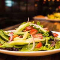 House Salad · Lettuce, topped with Cucumber, Tomato, Red Onion, and Raspberry Vinaigrette.