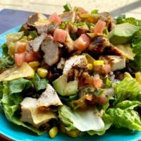 Southwest Chicken Salad · Lettuce topped with Grilled Chicken, Sweet Corn, Black Beans, Pico de Gallo, Avocado, Crumbl...