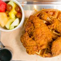 Fried Chicken & Waffles · Country Fried Chicken served on a Belgium Style Waffle with Maple Syrup on the side.