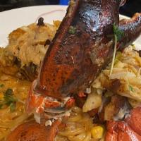 Lobster Fettuccine · Whole Lobster Tail Poached in Garlic Butter Tossed in Jambalaya Sauce Topped Over a Bed of C...