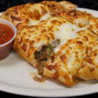 Steak Bomb Calzone · Mushrooms, onions and peppers.