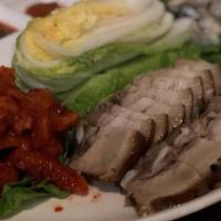  Sam Gyup Bo Sam/삼겹굴보쌈 · Hot & spicy. Thinly sliced pork belly served with lightly salted fermented cabbages with sau...