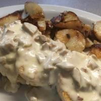 Sausage Gravy Over Biscuits · with home fries.