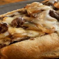 Philly Cheesesteak · Grilled rib eye steaks topped with melted provolone cheese on a toasted sub roll.
