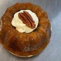 Carrot Cake  · Personal size 5' Carrot cake topped with cream cheese icing and pecans.