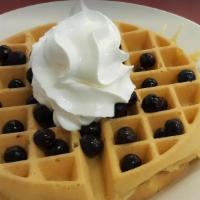 Fruit & Yogurt Waffle · Golden waffle topped with yogurt, fresh fruit and sprinkled with granola.