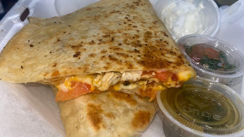 Chicken Quesadilla · With tomatoes & onions.