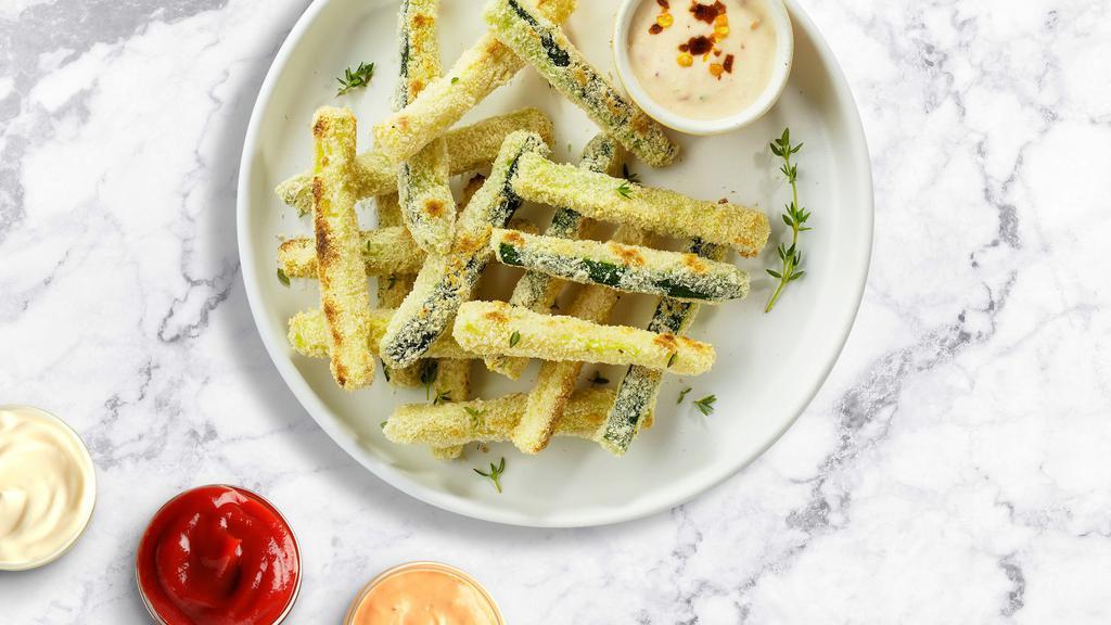 Zucchini Fries · (Vegetarian) Sliced zucchini breaded and fried until golden brown.