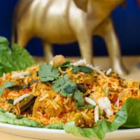 Chicken Biryani · Basmati rice cooked with onion and tomato sauce in aromatic spices along with almond cashew ...