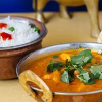 Chicken Curry · Chicken breast cooked in onion tomato sauce (dhaba styles).