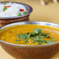 Ekta Dal · Yellow lentil cooked with onion and tomato.