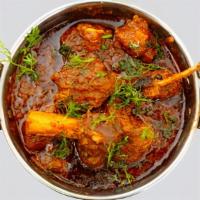 Kadai Lamb · lamb cooked with onions, peppers & spices
