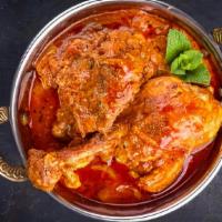 Hyderabadi Chicken Curry · Boneless chicken finished in house made curry sauce from Hyderabad spices