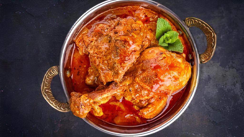 Hyderabadi Chicken Curry · Boneless chicken finished in house made curry sauce from Hyderabad spices