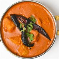 Madrasi Chicken Curry · Boneless chicken cooked with spices in chettinad sauce