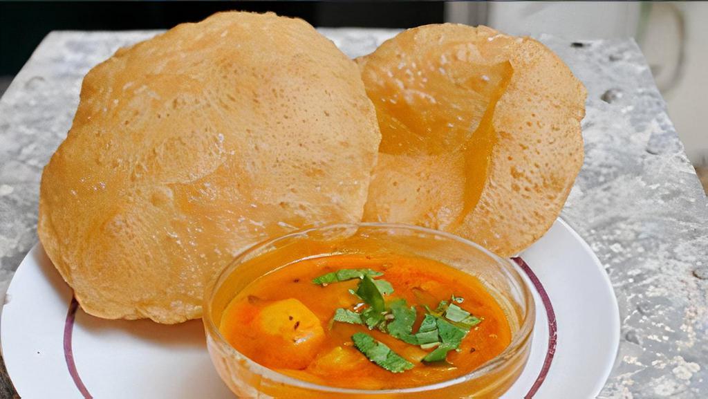 Amitabh Aloo Puri · Puffed wheat bread deep fried & served with potato curry