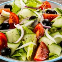 Greek Salad · Lettuce,  tomato, bell peppers, onions, feta cheese, black olives, and mushrooms.