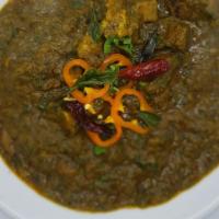 Gongura Mutton Curry · Gluten-free, spicy. Baby goat cubes cooked in traditional red sorrel leaves paste.